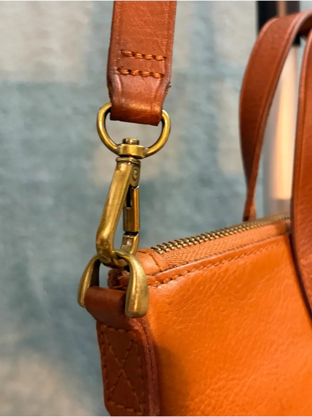 Madewell The Zip-Top Transport Crossbody Bag in English Saddle Leather.